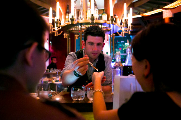 Joe Petch providing samples of Reykas Bitters to taste