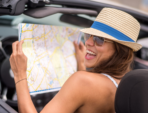 Woman traveling and looking at a map