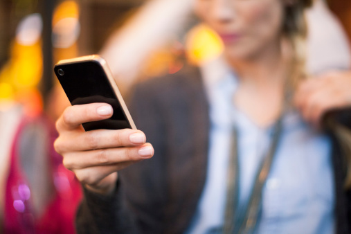 Woman taking selfie with smartphone